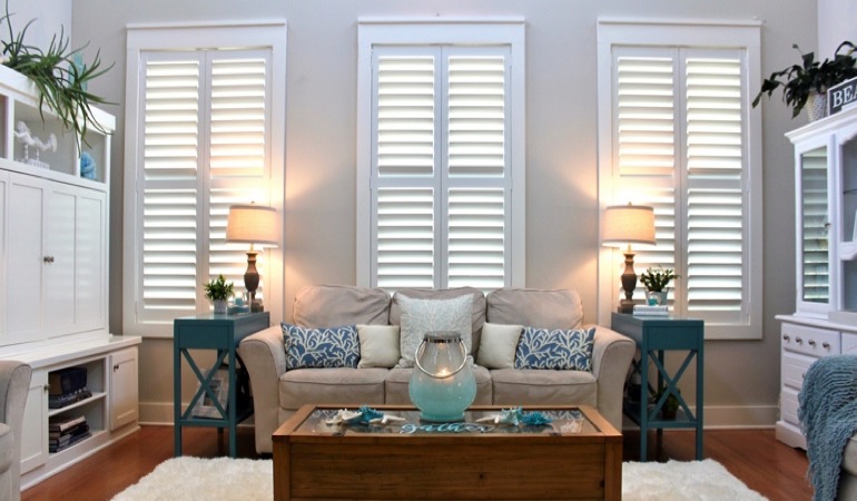 Cleveland modern sunroom with white shutters 